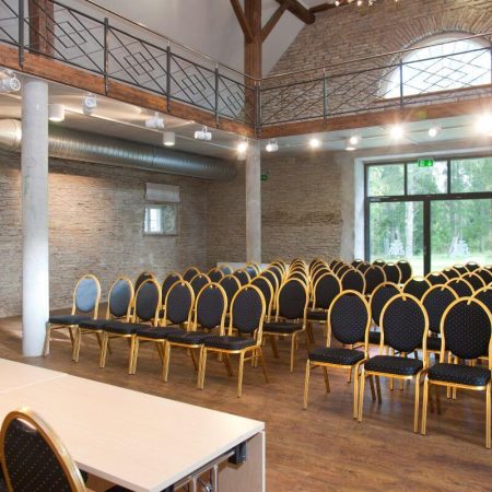 Auditorium seating and conference table prepared for venue cleaning