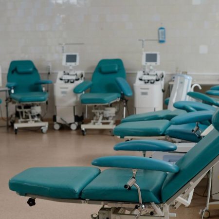 Medical facility seating with clean upholstered armchairs in a clinic setting