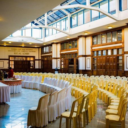 Wedding or banquet venue with chairs arranged before cleaning services